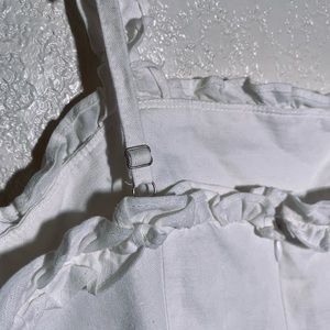 White mini dress with slit and ruffled straps